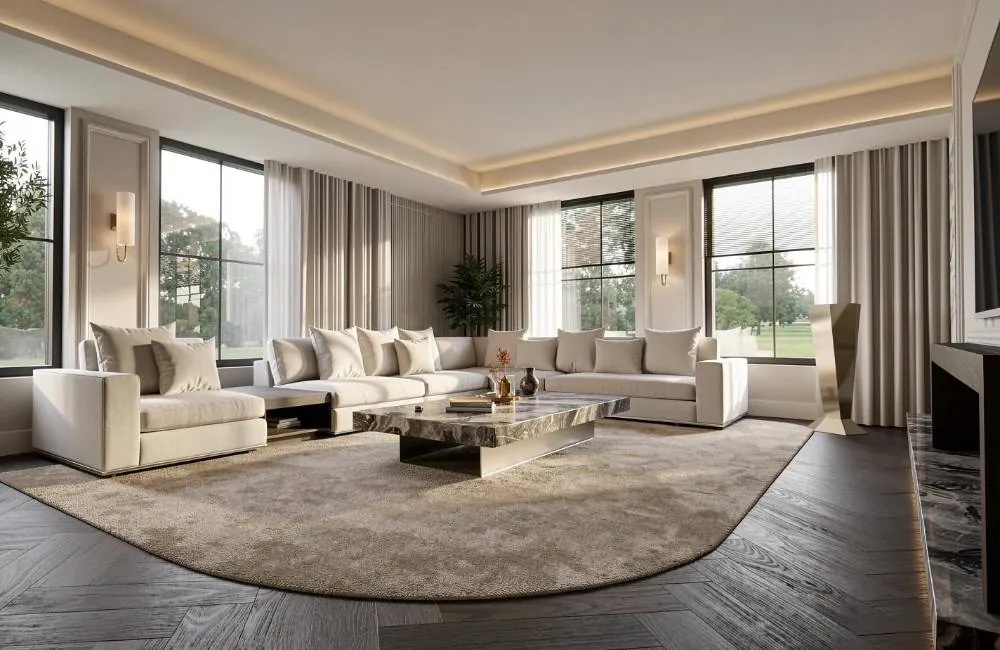 Ruime woonkamer met curved bank, ronde salontafel en grote raampartijen